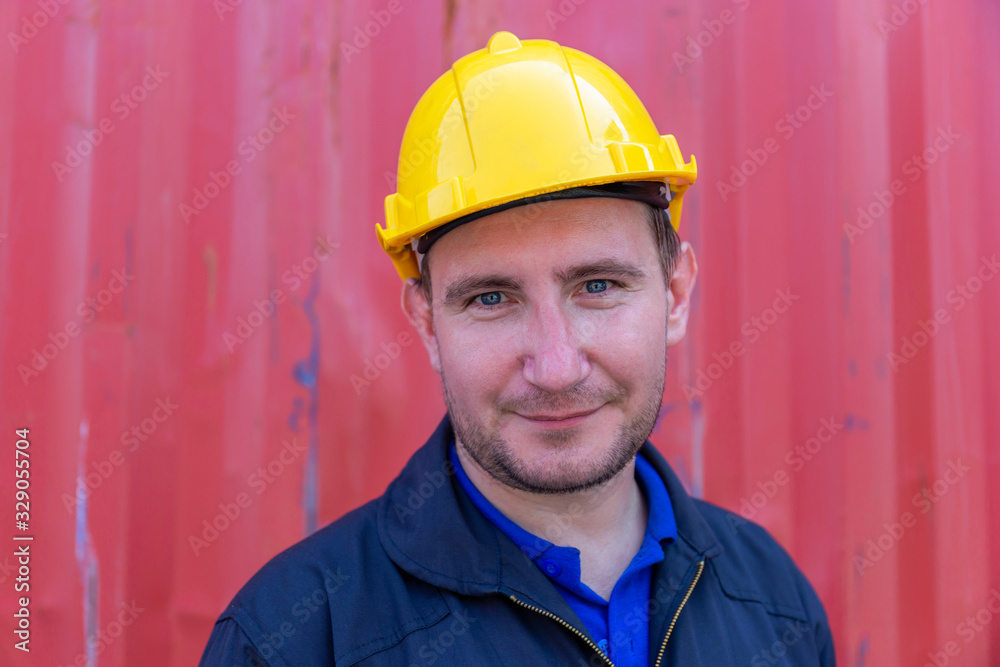 Cheerful factory worker man in hard hat smiling and looking at camera with joy, Happiness concept Cheerful factory worker man in hard hat smiling and looking at camera with joy, Happiness concept