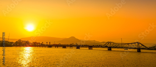 Vászonkép Kampot Old bridge during sunset in Cambodia.