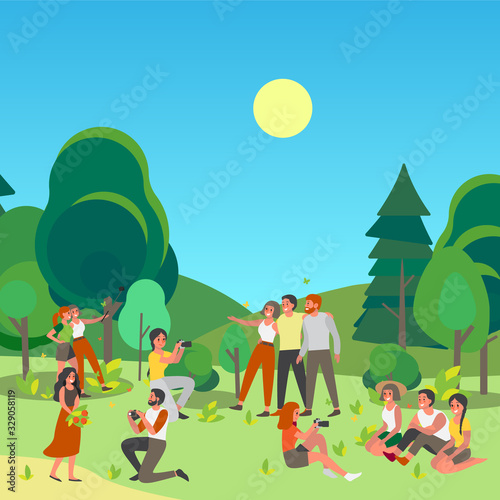 People tacking picture or making selfie together in public park.