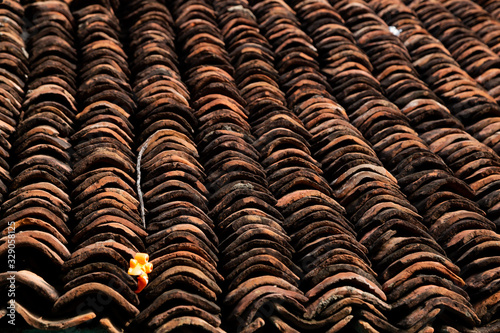 old clay roof tiles close up as background
