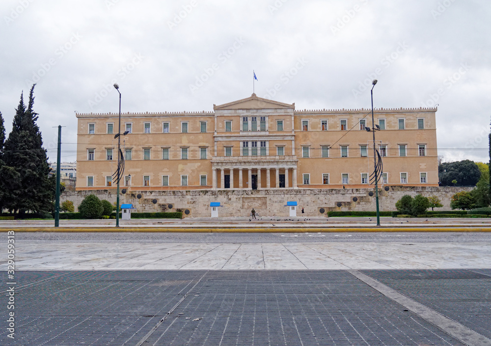 The Greek parliament building on constitution square under cloudy sky