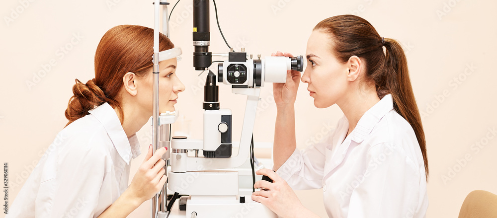 ophthalmologist doctor in exam optician laboratory with female patient. Eye care medical diagnostic. Eyelid treatment ophthalmologist doctor in exam optician laboratory with female patient. Eye care medical diagnostic. Eyelid treatment