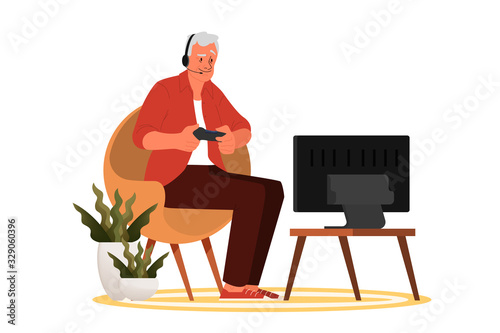 Old man playing video games. Senior playing video games