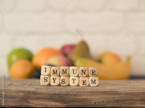 The words immune system on small wooden blocks, healthy eating concept