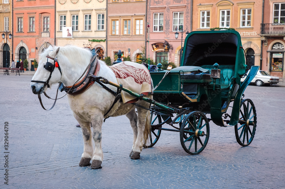 Horse drawn carriage on the Old Town of Warsaw city, Poland