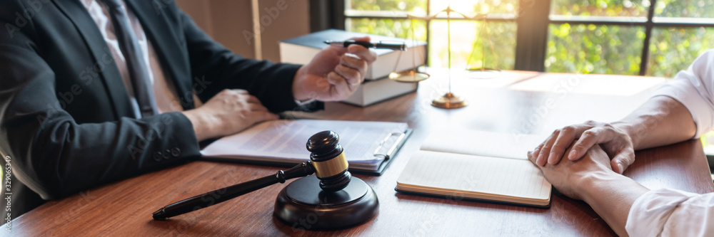 Male Notary lawyer or judge consult or discussing contract papers with Businessman client in office, Law and Legal services concept Male Notary lawyer or judge consult or discussing contract papers with Businessman client in office, Law and Legal services concept
