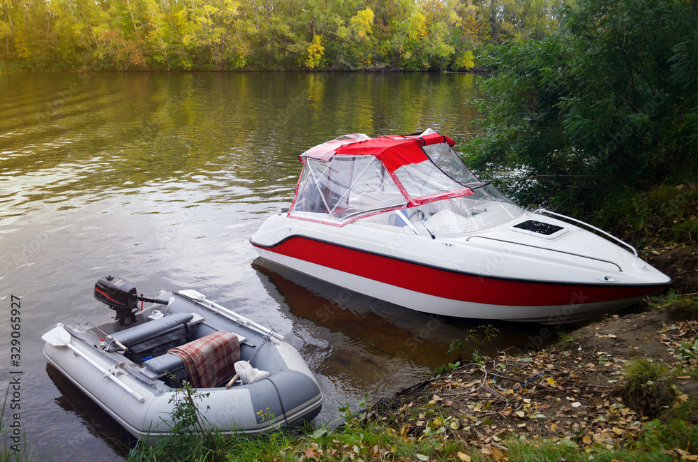 River fishing on the boat. Country rest. Camping with a shish kebab at the stake. Two fishing boats. River fishing on the boat. Country rest. Camping with a shish kebab at the stake. Two fishing boats.