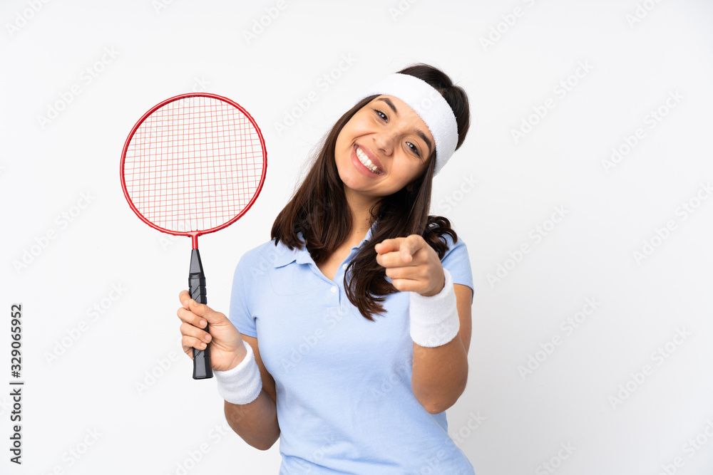 Young badminton player woman over isolated white background points finger at you while smiling Young badminton player woman over isolated white background points finger at you while smiling