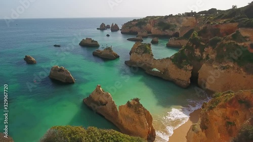 Aerial. A group of young surfers stand on surf boards, train their balance. Portugal Portimao Algarve