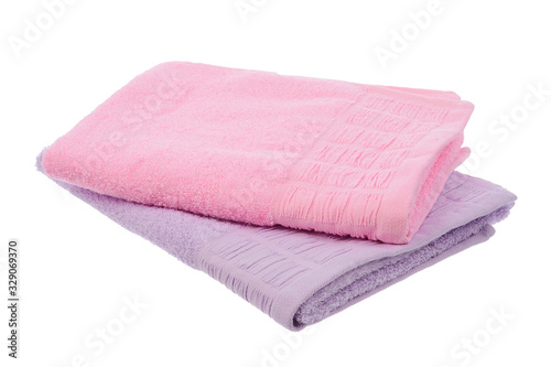 purple and pink towels lie on a white background