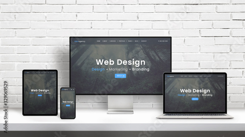 Web design agency concept presentation on displays of different dimensions. Modern flat web design template, theme concept. White brick wall in background