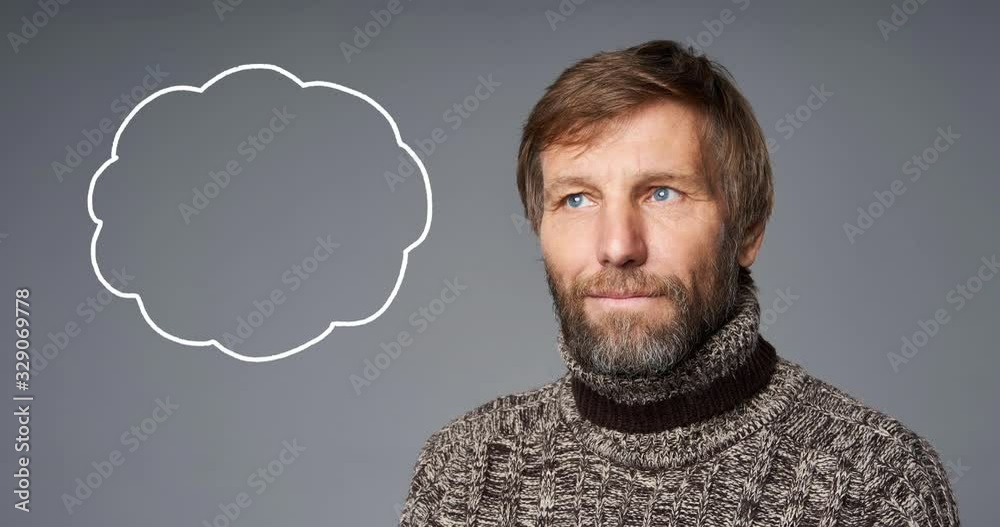 Closeup portrait of thinking contemplating mature man in warm sweater and hand drawn frame by frame chalk thinking bubble animation, over grey studio background