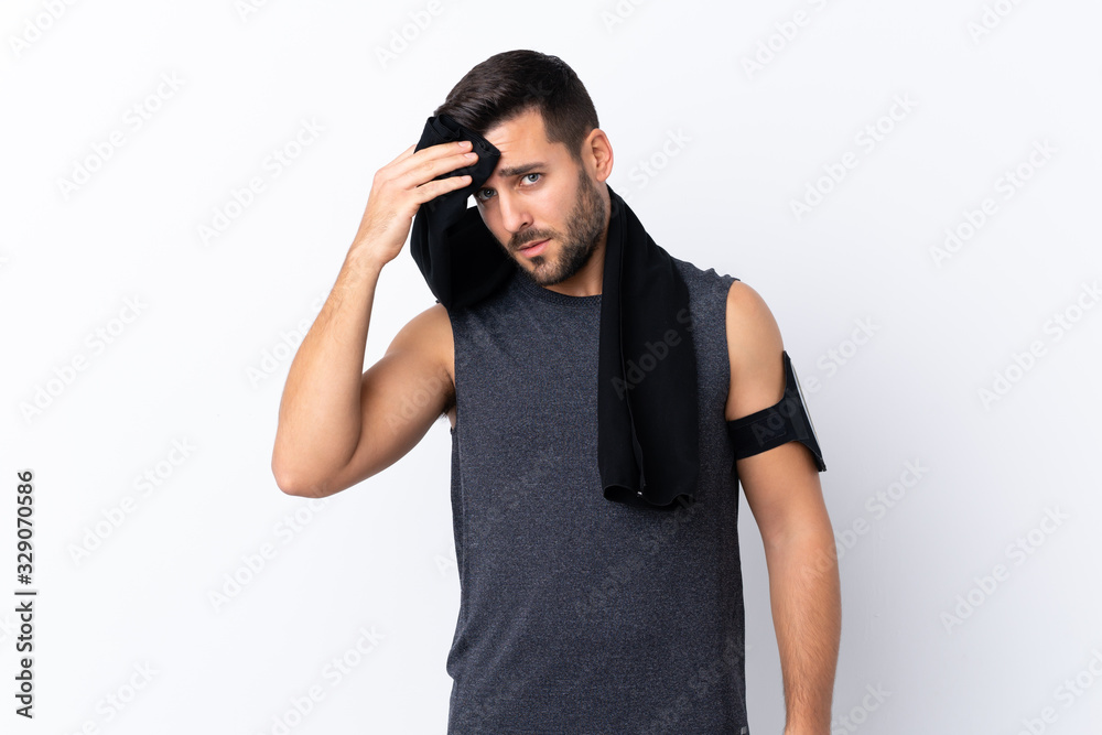 Young sport handsome man with beard over isolated white background with sport towel Young sport handsome man with beard over isolated white background with sport towel
