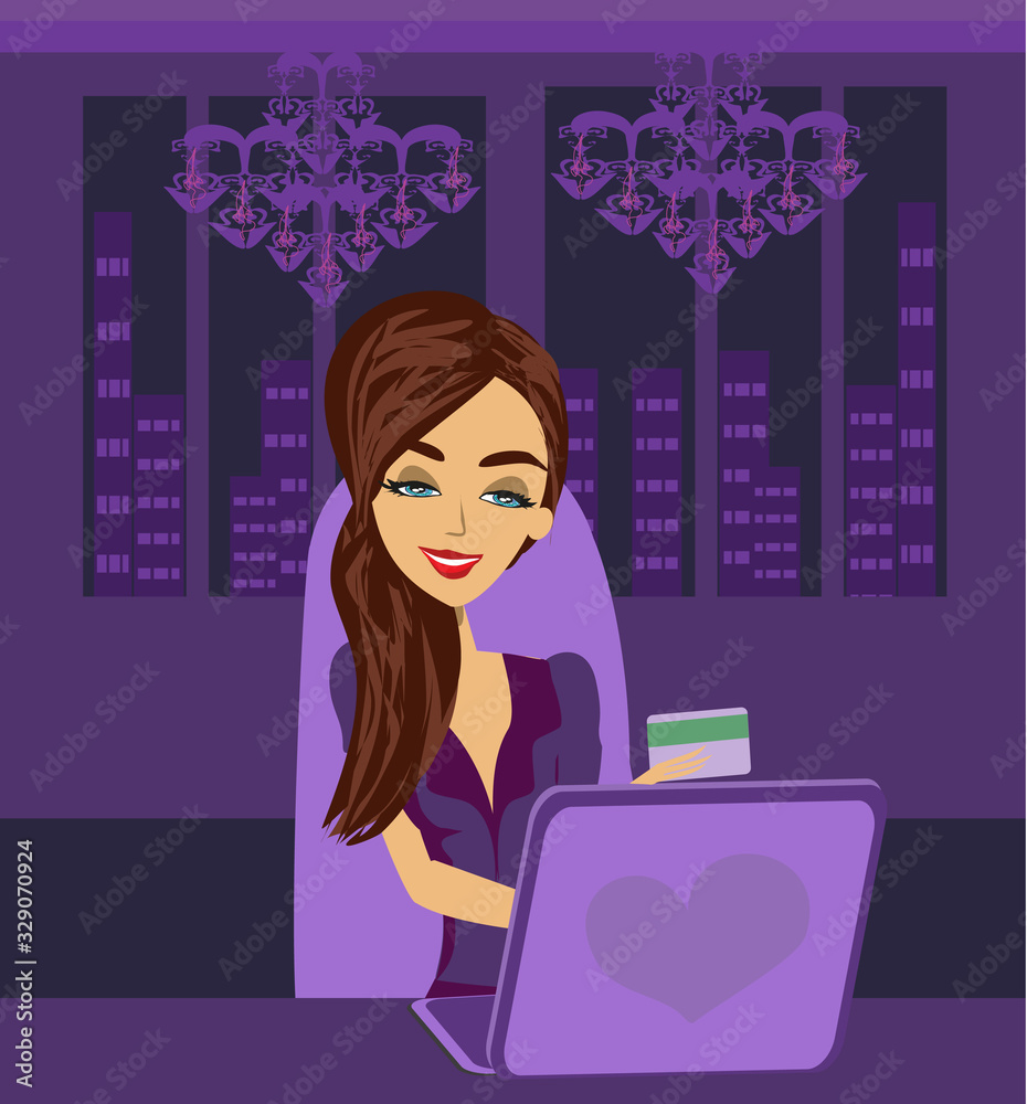 Online shopping - girl sitting with laptop computer in the night Online shopping - girl sitting with laptop computer in the night