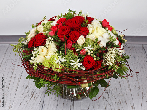 Flower arrangement with roses  anemones and cotton