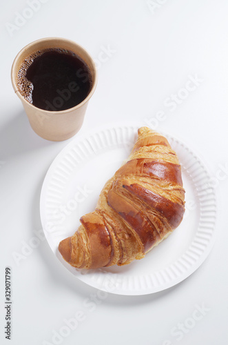 Croissant and coffee cup