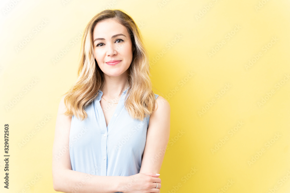 Smiling Caucasian Woman With Arms Crossed Smiling Caucasian Woman With Arms Crossed