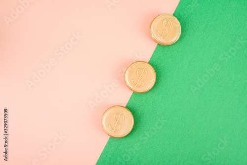 Three gingerbread in the navof of money on an abstract background of different colors.