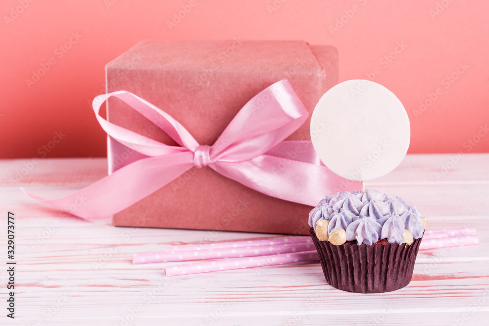 Chocolate cupcakes with small flowers of curd cream. Place for the inscription. Chocolate cupcakes with small flowers of curd cream. Place for the inscription.