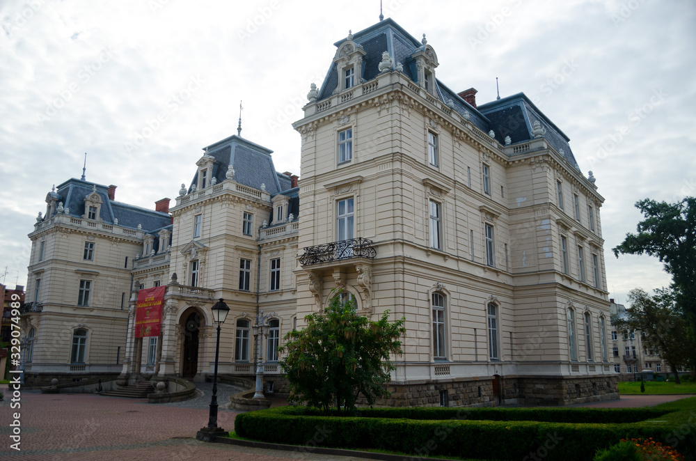 Fototapeta premium The Palace of Count Potocki in Lviv. An old mansion with a lawn. The palace in the style of French classicism. Medieval Europe. Lviv, Ukraine, July 18, 2017