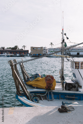 Fishing boat near the pier after the sea