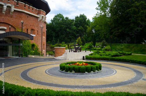 A picturesque landscaped garden at the citadel in Lviv. Fortification defensive brick building of the Middle Ages. Beautiful summer landscape for postcards and background. Lviv, Ukraine, July 23, 2017