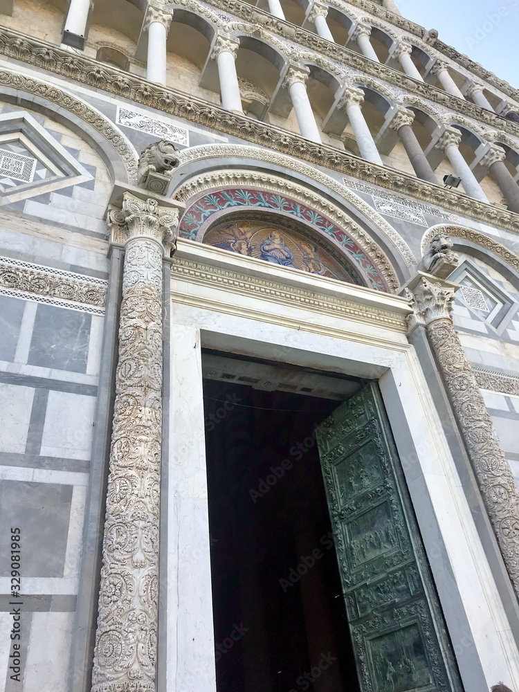 The architectural uniqueness and variety of sculptural ornaments of the famous Leaning Tower of Pisa. The architectural uniqueness and variety of sculptural ornaments of the famous Leaning Tower of Pisa.