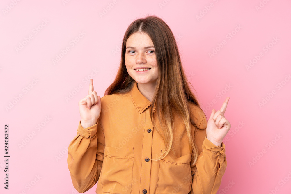 Ukrainian teenager girl over isolated pink background pointing up a great idea Ukrainian teenager girl over isolated pink background pointing up a great idea