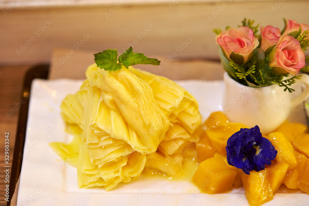 Shaved frozen mango with mango fruit Shaved frozen mango with mango fruit