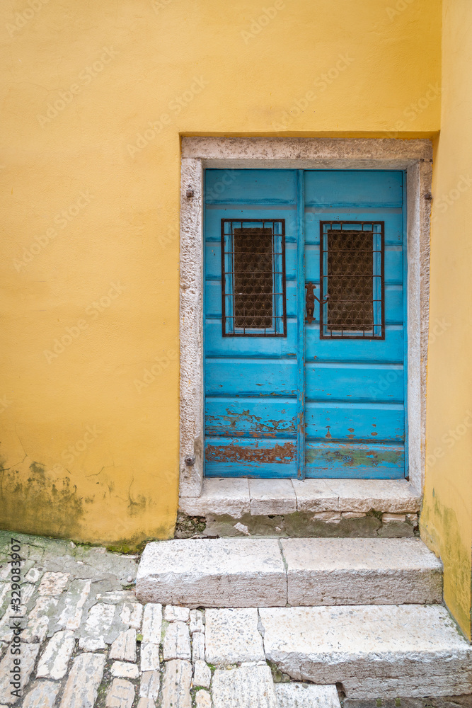 Fototapeta premium Blue entrance door of an old house in Rovinj, Croatia, Europe.