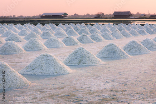 Panorama of beautiful landscape salt farm with sunset at Samutsakhon Thailand photo