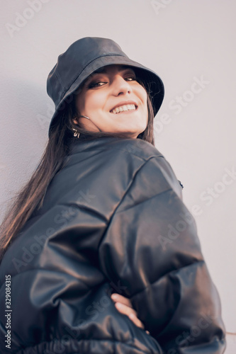 portrait of modern brunette girl in the street