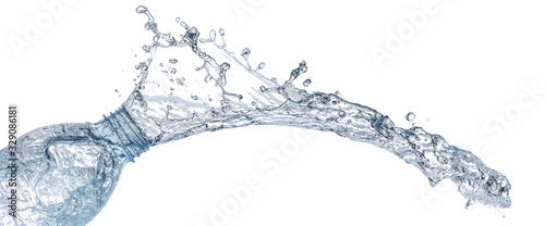 isolated of water splashing form the bottle on white background.