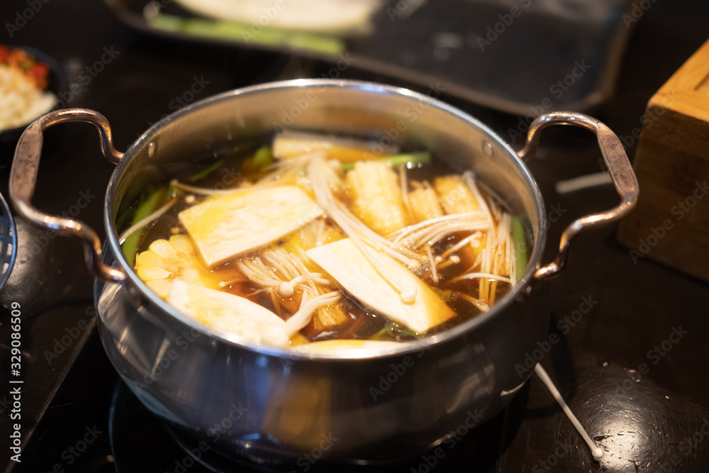 Golden needle mushroom in hot pot Sukiyaki