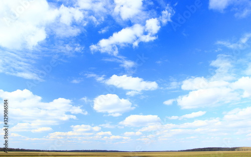 Beautiful day i nature, blue sky with some cloud, spring landscape © Simun Ascic