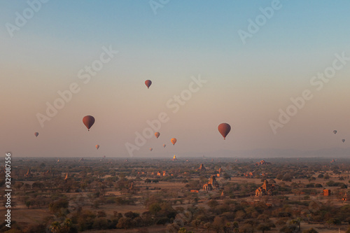 Beautiful View of Bagan at Sunrise with Hot Air Balloons over Temples Stupas Pagodas