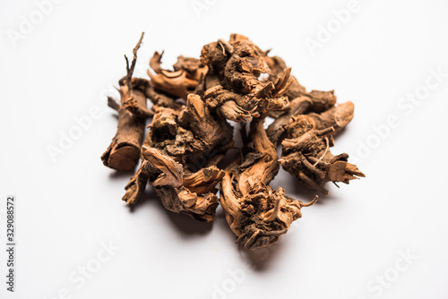 Ayurvedic herb chitrak or Plumbago zeylanica roots, isolated over white background photo