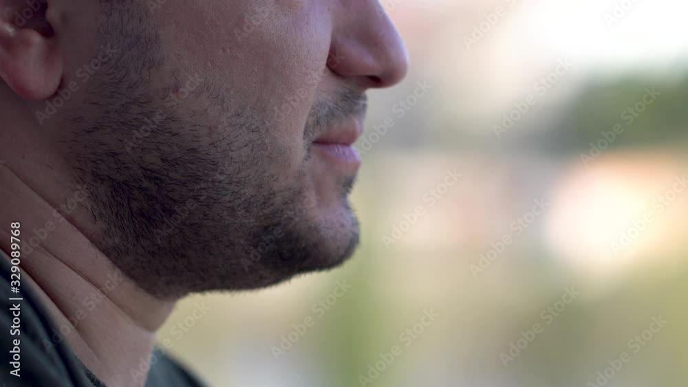 Macro shot of the man smoking cigarette. Dangerous for health Macro shot of the man smoking cigarette. Dangerous for health