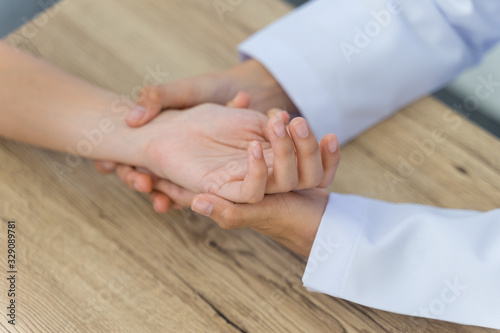 Wallpaper Mural Close up of a doctor holding the patient hands doing basic medical examination and diagnostic. Torontodigital.ca