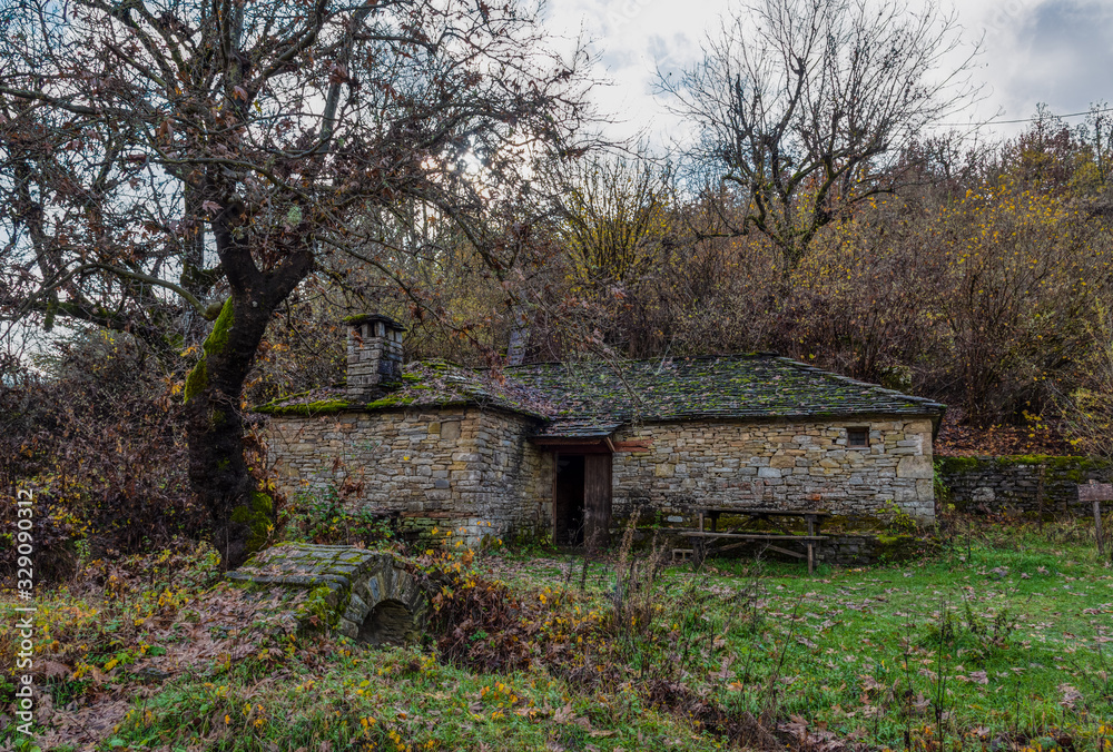 Stone water mill in autumn scene Stone water mill in autumn scene