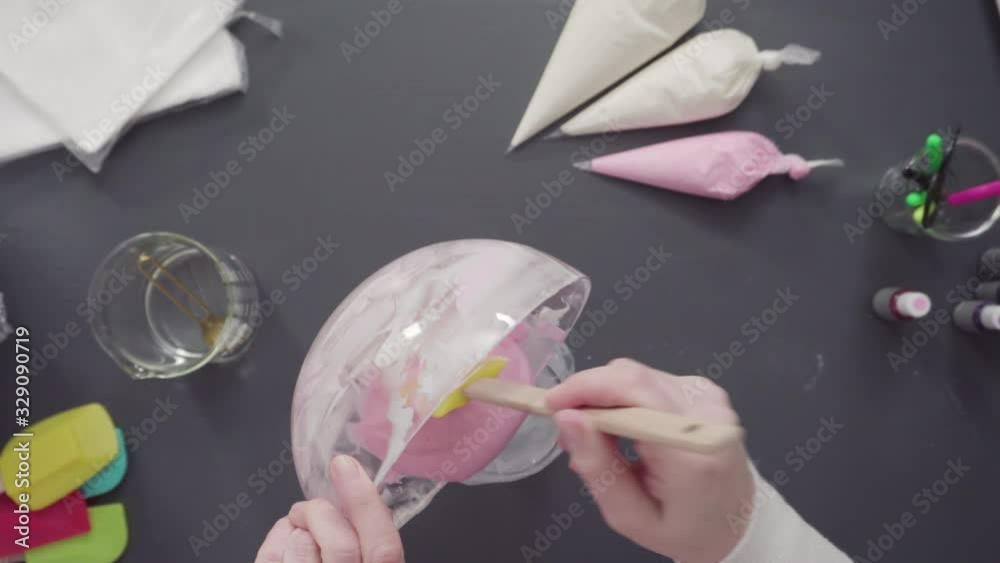 Step by step. Flat lay. Mixing in food coloring into the royal icing to decorate sugar cookies. Step by step. Flat lay. Mixing in food coloring into the royal icing to decorate sugar cookies.