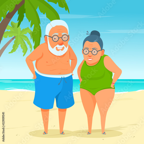 An active happy elderly couple standing on beach sand. Summer sunny day. Cute funny grandma and grandpa. A cartoon senior adult in swimwear. Sea on the background.