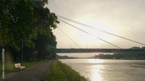 Photography Capital of Slovakia - Bratislava Cityline with Castle, Church Tower, Car SNP Bridge over Danube River at Summer Sunset