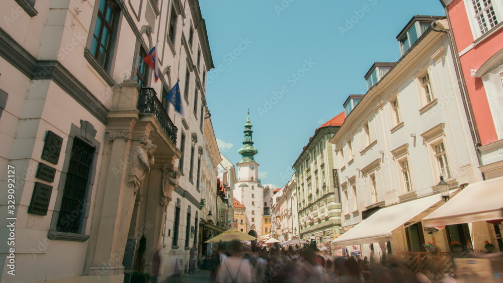 Landmark Capital of Slovakia - Bratislava, Tourists People Walking and Sightseeing in Old Town, Michalska Street with Medieval Michael's Gate (Brana)
