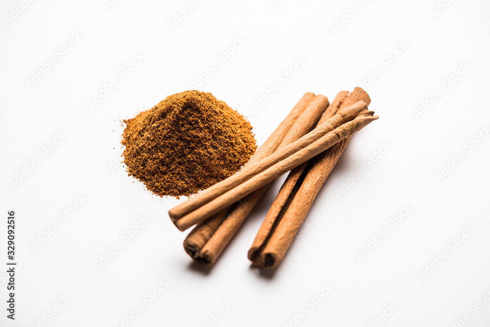 Powder cinnamon and sticks also known as Dalchini or Dalcheenee masala from India, selective focus Powder cinnamon and sticks also known as Dalchini or Dalcheenee masala from India, selective focus