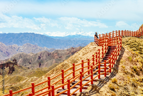 Girl enjoys the view in Binggou Danxia Scenic Area photo