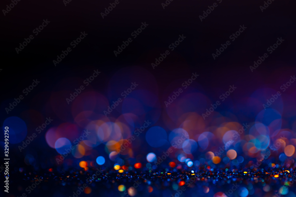 Festive bokeh glitters background, abstract blurred backdrop with circles,modern design wallpaper with sparkling glimmers. Black, blue and golden backdrop glittering sparks with blur effect - obrazy, fototapety, plakaty 