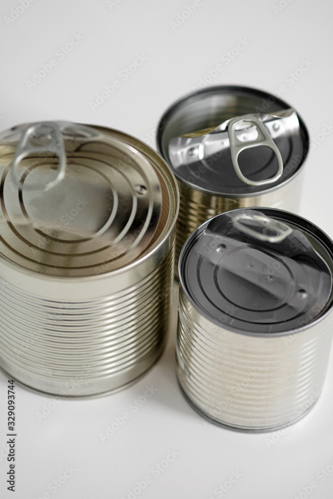 Three empty tin cans on a gray background, Selective focus.Concept of Recycling, ecology and minimalism. Plastic waste. Stop nature garbage, ecology environment protection concept. Three empty tin cans on a gray background, Selective focus.Concept of Recycling, ecology and minimalism. Plastic waste. Stop nature garbage, ecology environment protection concept.
