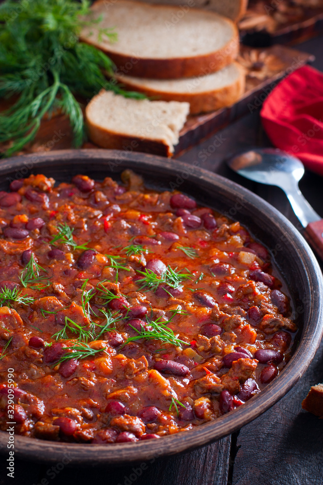Chili con carne, traditional Mexican dish with beef and beans, selective focus