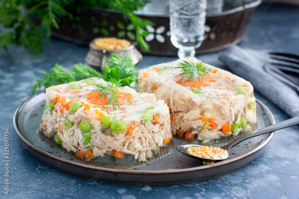 Homemade jelly with chicken, pork peas with slices of carrots, horizontal